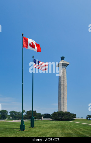 Perry Memorial with American and Canadian Flags in the Foreground South Bass Island Ohio Stock Photo