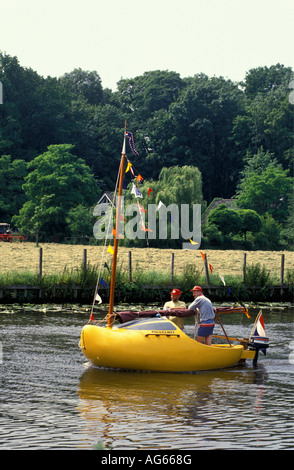 Netherlands Vreeland People traveling in sailing boat in shape of clog Stock Photo