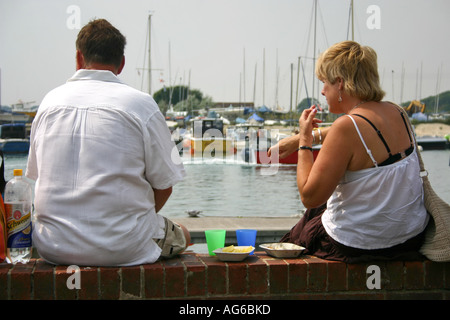 husband and wife enjoying habour picnic, Littlehampton Stock Photo