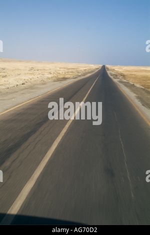 Egypt, Red Sea -  Driving on a straight empty desert road between Quoseir And Marsa Alam Stock Photo