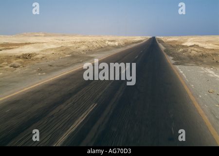 Egypt Red Sea Between Quoseir And Marsa Alam - Driving On A Long Straight Empty Highway In The Desert Stock Photo