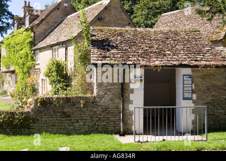 The stone bus shelter in the Cotswold village of Eastleach Turville, Gloucestershire Stock Photo