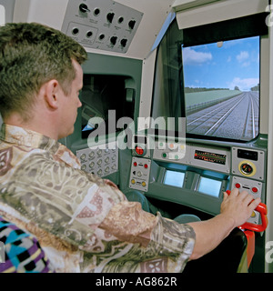 London Underground trainee driver receives instruction in a interactive Corys Tess virtual reality train cab simulator. Stock Photo