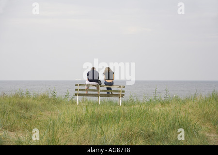 Couple On A Bank At The Baltic Sea Beach Of Ahlbeck Island Usedom