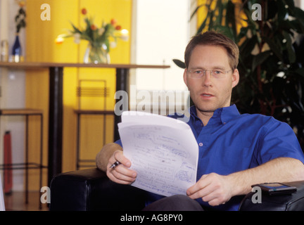 Young man is reading MR Stock Photo