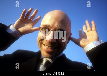 Bald man in suit smiling Model released image Stock Photo