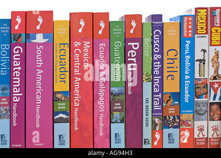 Selection of Travel Guide Books to various destinations on a shelf Stock Photo