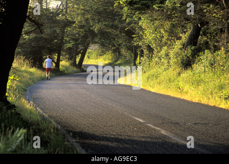 Man running on Hill Road Ebeys Landing National Historic Reserve Coupeville Whidbey Island Washington Stock Photo