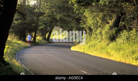 Man running on Hill Road Ebeys Landing National Historic Reserve Coupeville Whidbey Island Washington Stock Photo