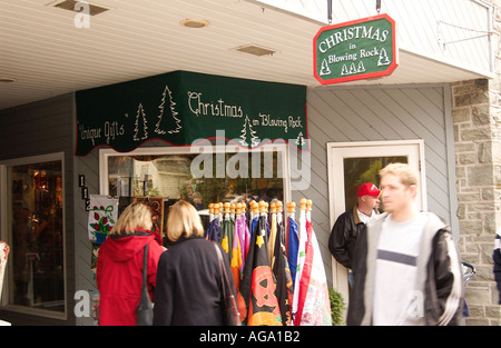 Shoppers browsing and picking out unique gifts and holiday decorations at a Christmas shop in Blowing Rock, North Carolina, USA. Stock Photo