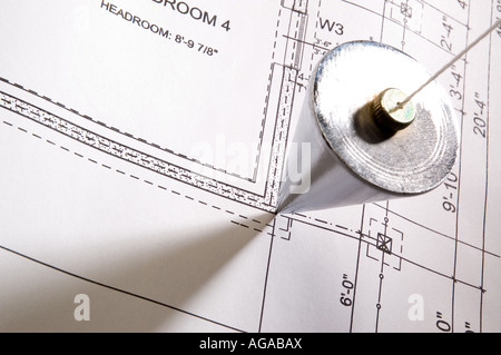 Plumb bob placed on a blue print Stock Photo - Alamy