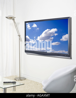 Plasma TV television on wall flat screen monitor vertical Stock Photo