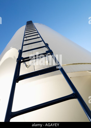 Low angle view of metal grain storage silo with ladder assending to top Stock Photo