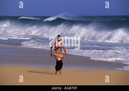 Polynesian woman on windy beach in Hawaii Stock Photo