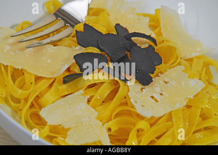 Tagliatelle with shaved black truffles and parmesan cheese Stock Photo