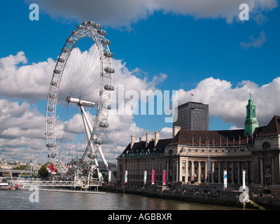The London Eye ferris wheel on the banks of the Thames River. Stock Photo