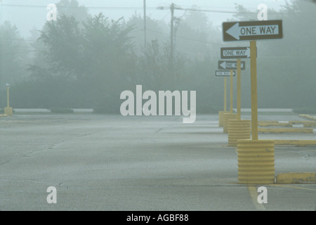 One way signs in fog Stock Photo