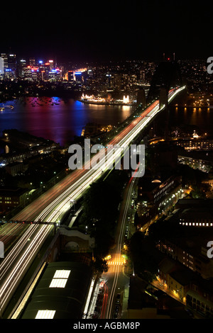 High level aerial oblique view at twilight night or dusk of Harbour Bridge with light trails in Sydney New South Wales NSW Aust Stock Photo