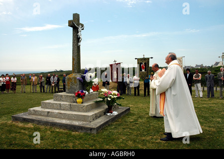 On Brittany's Finistère coast priests offer prayers near St-Tugen chapel during the annual Pardon, or religious festival Stock Photo