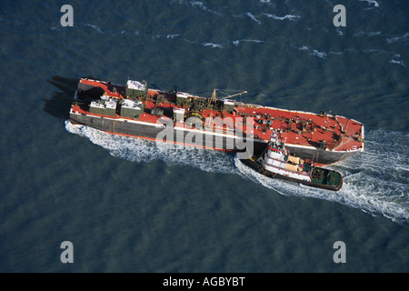 Aerial view of tugboat pushing tanker Stock Photo