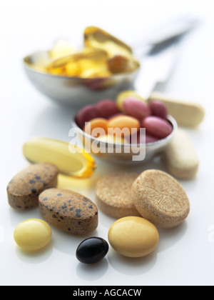 Vitamin pills and supplements tablets on a white background Stock Photo