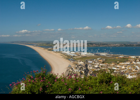 View of Chesil Beach and Portland Harbour looking down from Portland Stock Photo