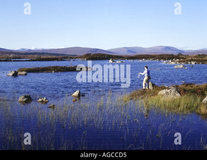 dh Lochan na h Achlaise RANNOCH MOOR ARGYLL Angler casting fishing line freshwater lake flyfishing fisherman fly fish highlands loch Stock Photo