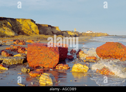 BRICK BASE OF LOW LIGHT LIGHTHOUSE REMAINS ON BEACH AT  HAPPISBURGH NORFOLK EAST ANGLIA ENGLAND Stock Photo