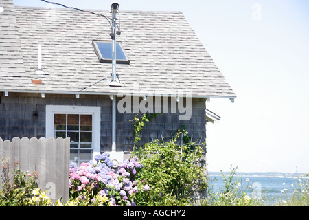 Cottage overlooking water on Marthas Vineyard Cape Cod Stock Photo