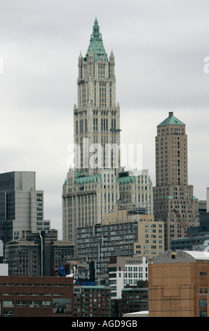 top of the Woolworth and transportation building 233 Broadway against a grey sky from the hudson river Stock Photo