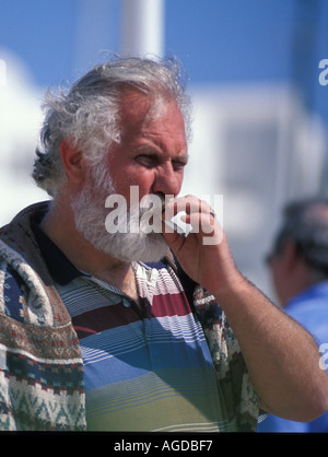 middle aged man smoking cigarette Stock Photo