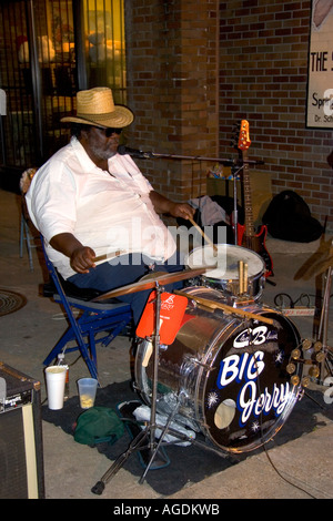 A musician playing the drums on Beale Street in Memphis, Tennessee. Stock Photo