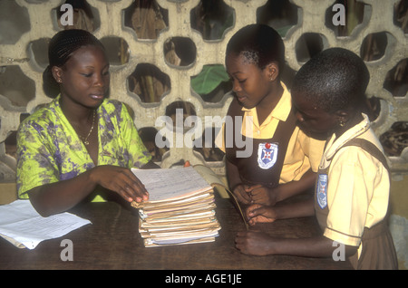 Female Schoolteacher with two girl students Accra Ghana Stock Photo