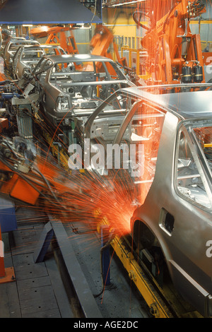 Sparks flying from robatic spot welding at SAAB Scania plant in Sweden Stock Photo