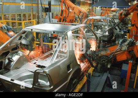 Sparks flying from spot welding robotics in SAAB Scania plant in Sweden Stock Photo