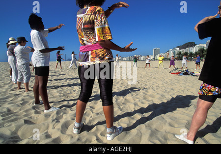 Brazil, Rio de Janeiro, Women doing Tai Chi at Copacabana Beach Stock Photo