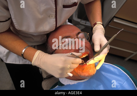 Dental hygienist at work, London, UK. Stock Photo