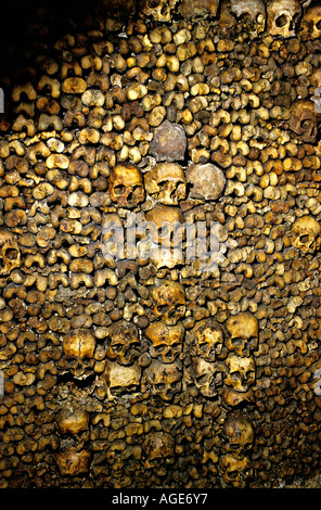 Skulls made into a pattern with femur leg bones in the catacombs Paris France Stock Photo
