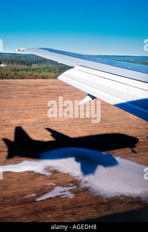 An airplane window view of wing and flaps after landing. Landing ...