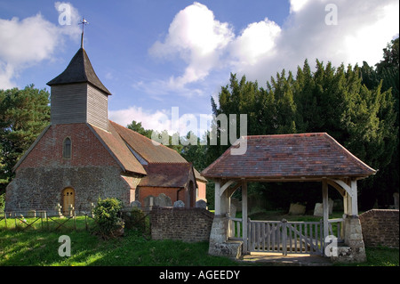 An old English13th century rural church with wooden steeple Stock Photo
