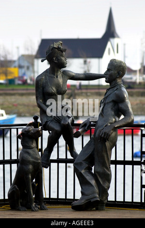 Art work depicting local couple at Cardiff Bay with the Norwegian Church in the background Wales UK Stock Photo