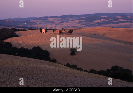 A classic tuscan image of a cute church sitting in the Val d'Orcia landscape near San Quirico Tuscany Italy Stock Photo