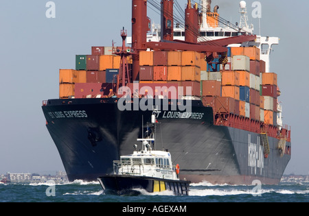 Close up,St Louise Express, Container ship with Southampton Harbour Patrol Boat Pilot The Solent Isle of Wight Stock Photo