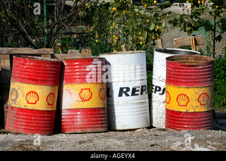 old oil containers shell repsol Stock Photo