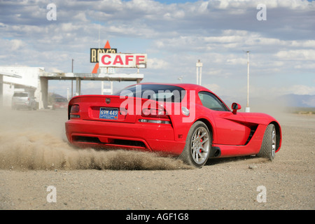The famous and iconic Roy's Diner in Amboy, california, on the old route 66 with a Dodge Viper. Stock Photo