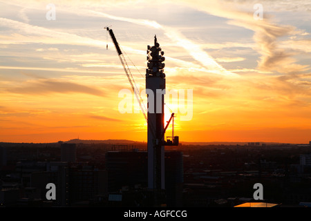 A crane in front of the BT Tower in Birmingham England UK Stock Photo