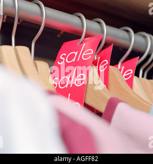 Sale labels on clothes hangers Stock Photo