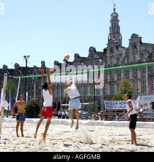 Beach volleyball being played on imported sand in the town centre of Arras northern France Europe Stock Photo