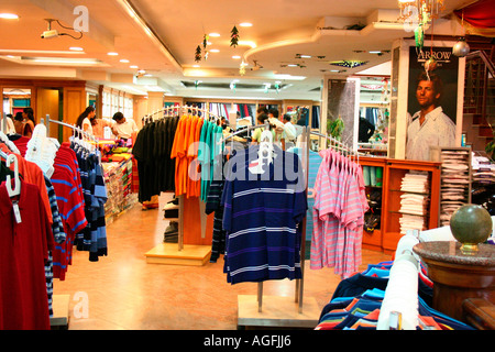 A busy textile shopping centre in India seen displaying major international brands Stock Photo