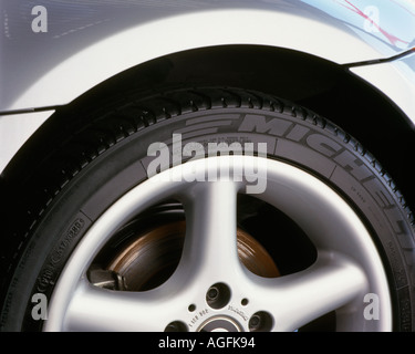 Closeup of an alloy wheel and tyre on a silver BMW sports car Stock Photo